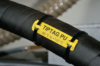 Applikasjonsbilde av gule TIPTAG merkeskilt som tåler høye temperaturer