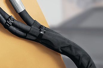 Bristbeskyttelse for hydraulikkslanger